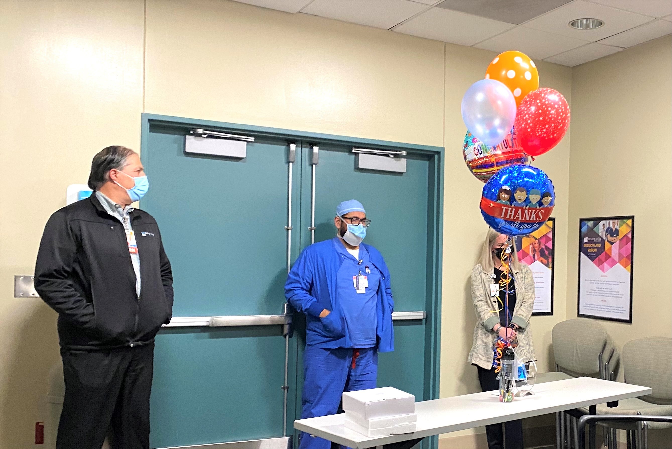 VP of Physician Services Ron Wheaton and Director of Surgery Services, Christen Rios, MSN, RN, CAPA, PHN join October 2021 Leader of the Month Osvaldo Batres, RN, BSN, PHN as his nomination is read out to him by ARC team members.