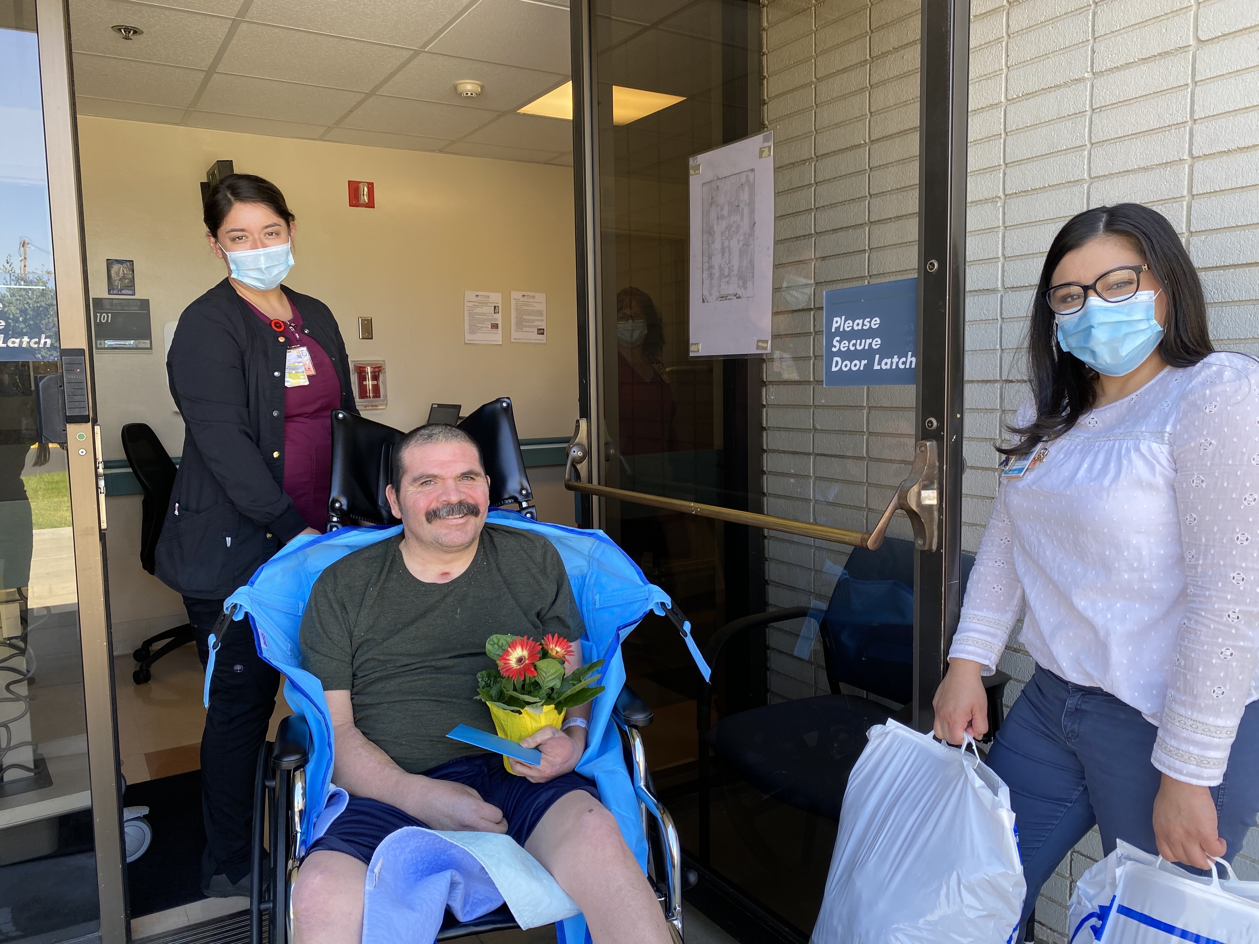 Mr. Torres smiles at the camera as he says farewell to his care team at the Sierra View DP/SNF.