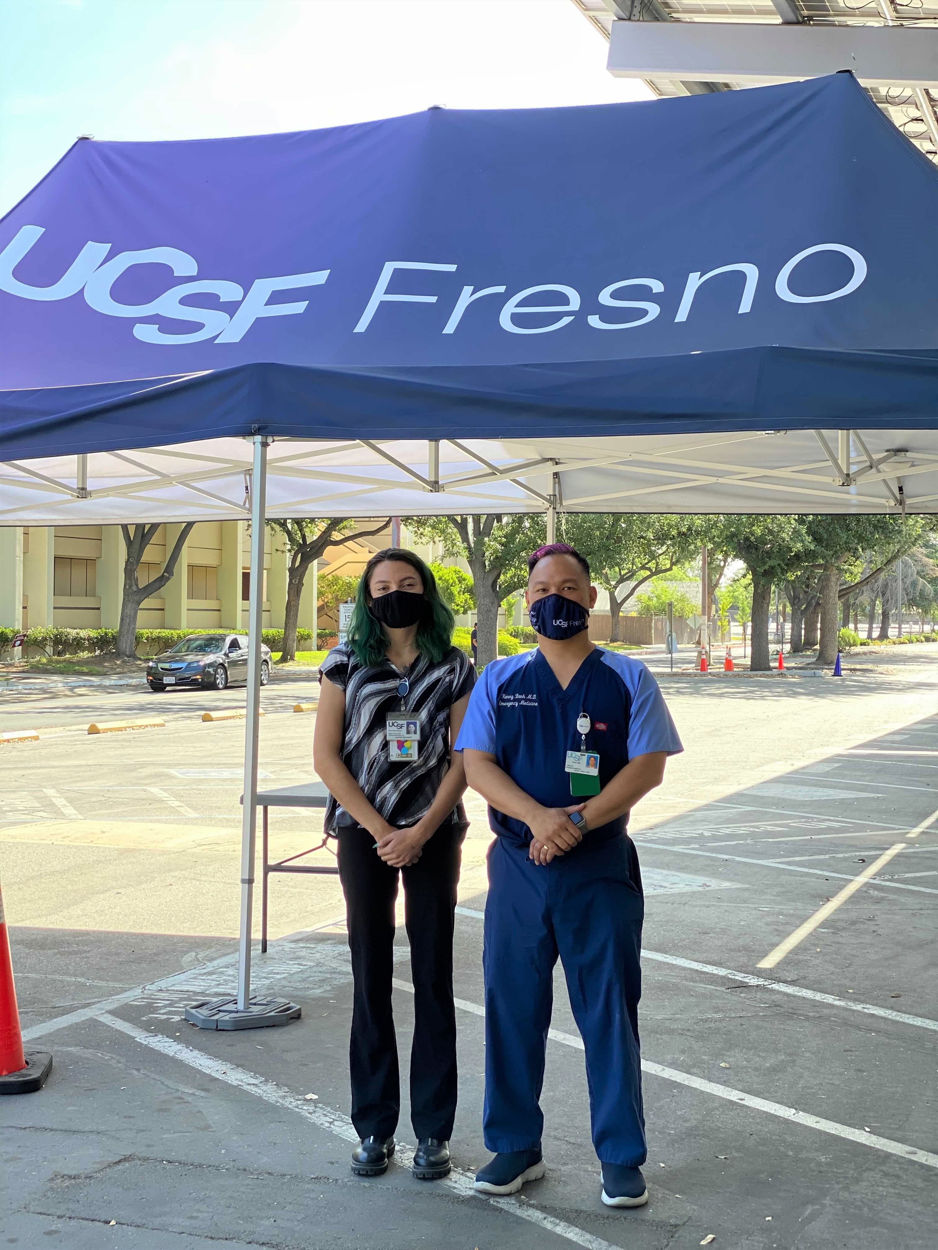 UCSF Fresno COVID-19 Equity Project team members at the Fresno City College vaccination site. From left to right: COVID-19 Equity Project Operations Specialist Juanita Sprowell and UCSF Fresno’s Associate Dean of Undergraduate Medical Education Dr. Kenny Banh, MD, FACEP