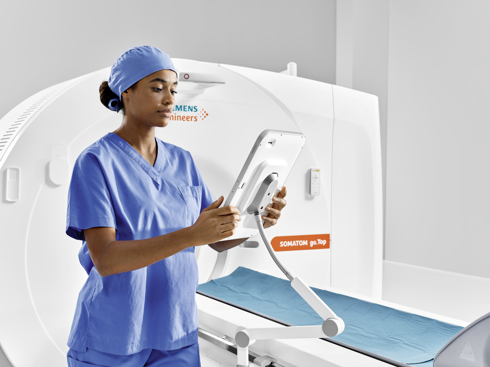 SOMATOM go.Top CT Scanner with tech operating touch pad